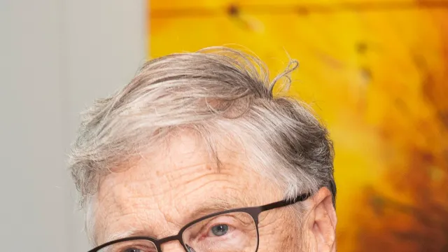 Bill Gates speaking at a podium beside a European Union flag during a visit to the European Commission, 11 October 2023. Photo by Lukasz Kobus / European Commission, CC BY 4.0, via Wikimedia Commons.